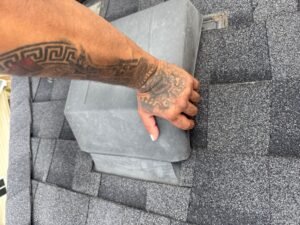 Roof repair contractor inspecting a damaged roof in Rosenberg, addressing urgent leaks and missing shingles.