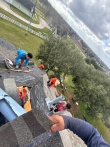 Professional roof repair services in Brays Oaks, featuring skilled technicians addressing leak issues on a residential roof.