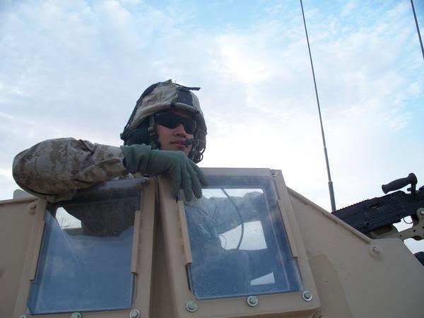 Marine manning the turret of an armored vehicle in Iraq