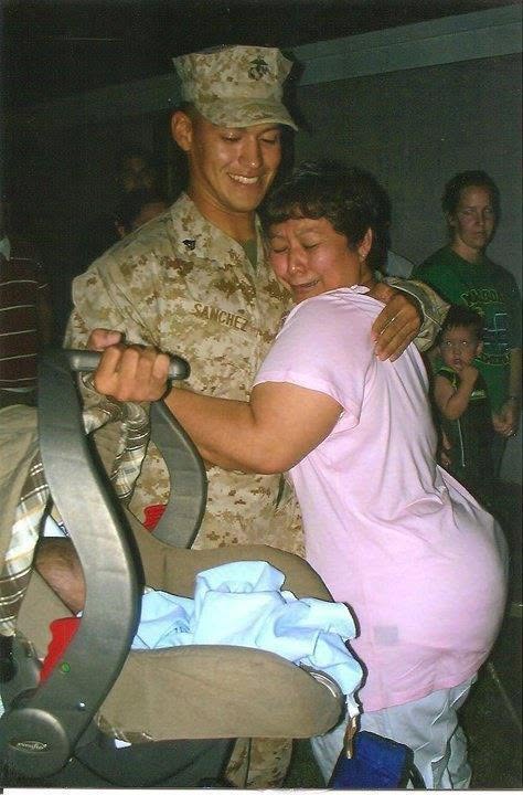 Marine Sanchez embraced by his mother before deploying overseas