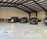 Roof Repair Services truck fleet in our warehouse